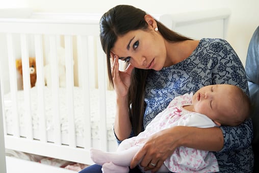 Tired Mother Suffering From Postpartum Depression