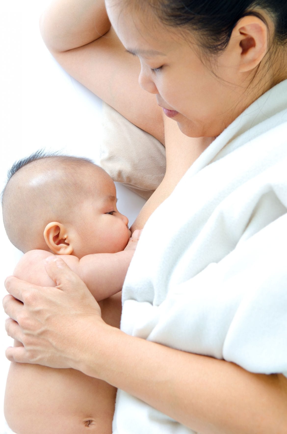 Mom breastfeeds her newborn baby